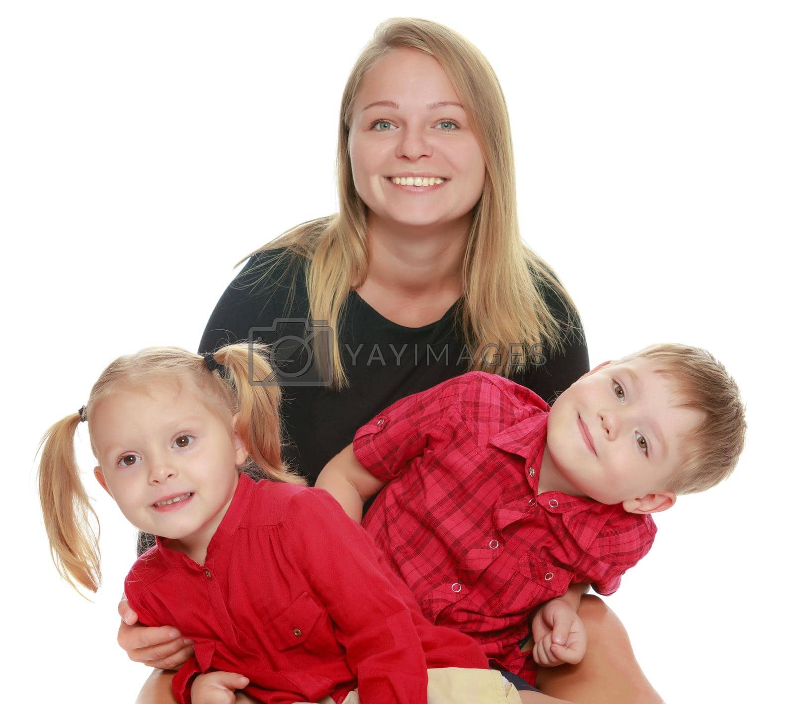 Happy young mother with two small children , a boy and a girl of preschool age.Isolated on white background