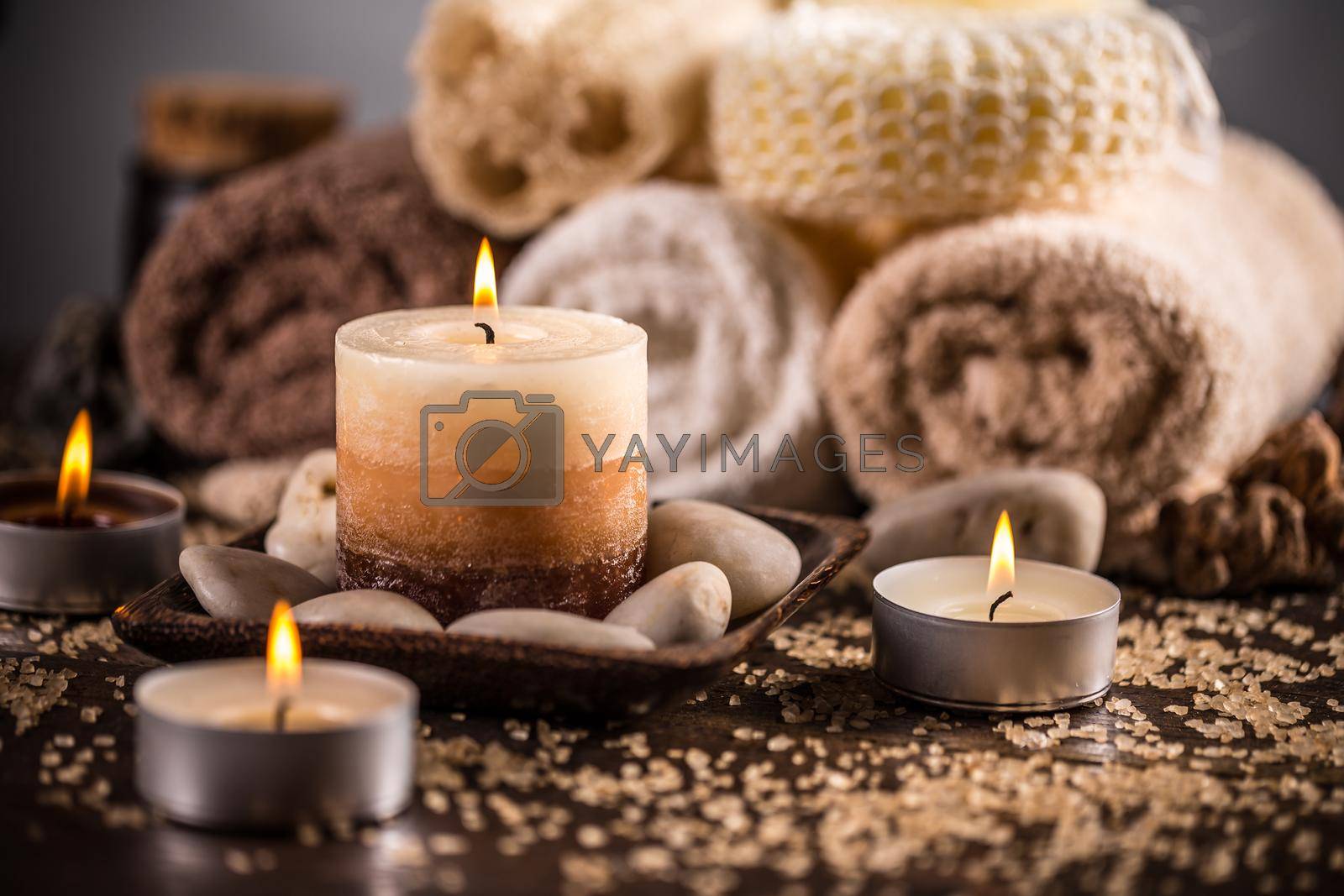 Spa still life with aromatic candles and towels