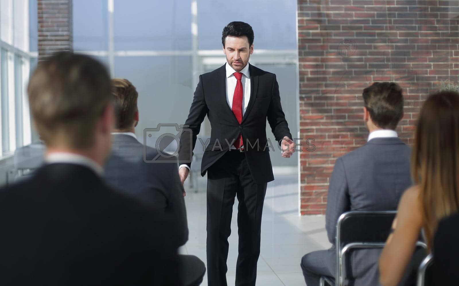 Royalty free image of businessman holds a briefing for the business team by asdf