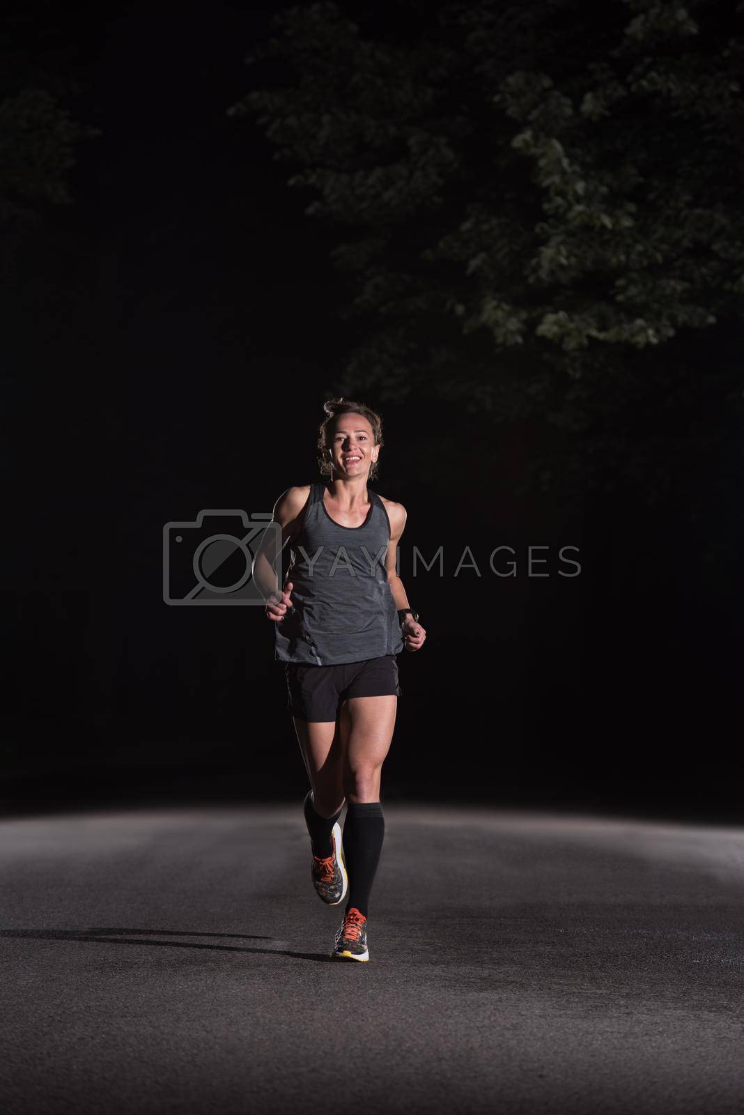Royalty free image of female runner training for marathon by dotshock