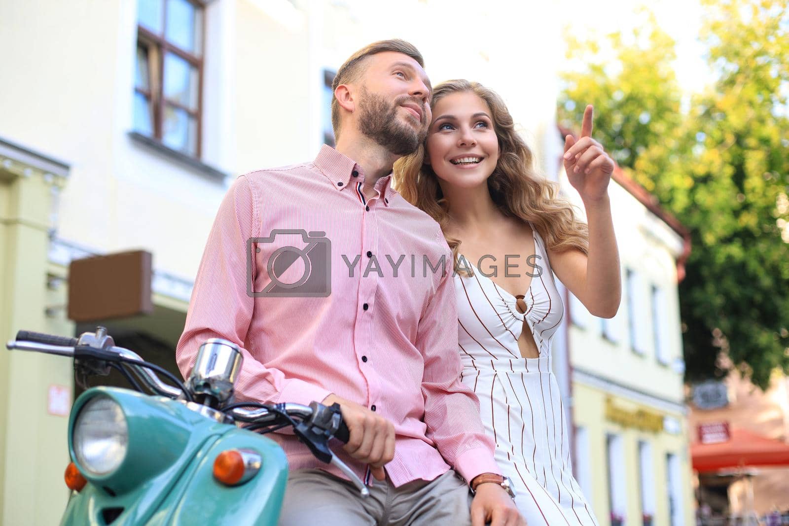 Royalty free image of Young beautiful couple riding on motorbike. Adventure and vacations concept. by tsyhun