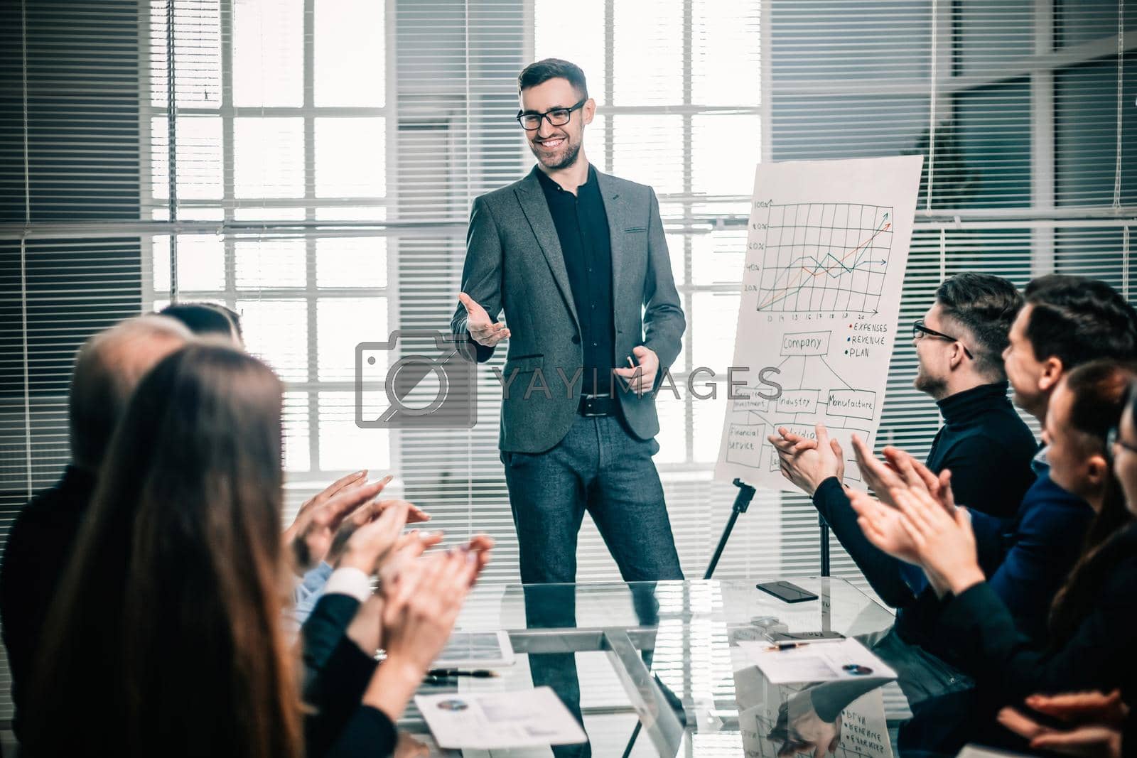 Royalty free image of business team applauds the speaker at the business presentation by SmartPhotoLab