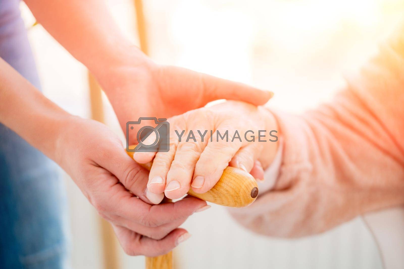Royalty free image of Helping hands for old woman by GekaSkr