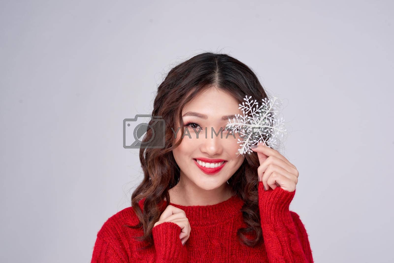 Portrait of beauty winter asian girl in red knitted woolen dress