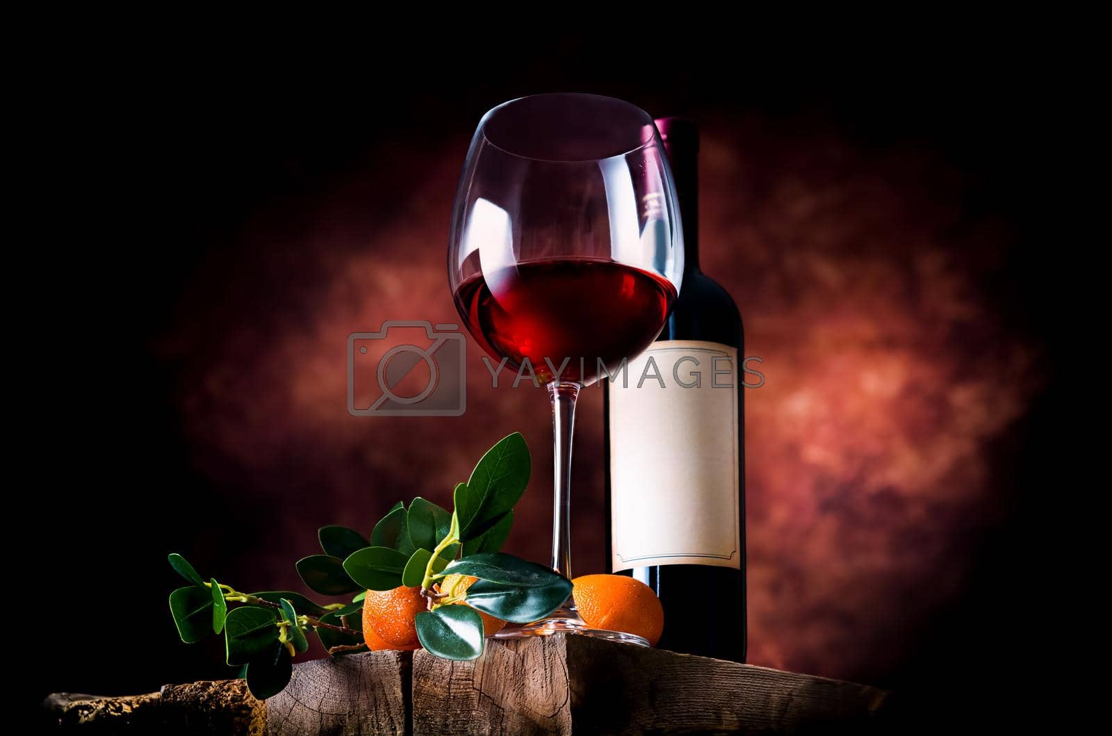 Royalty free image of Tangerine wine in glassware by Givaga