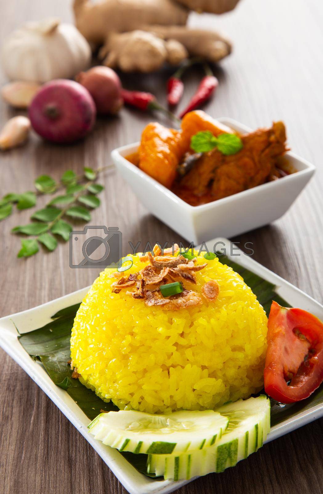 Royalty free image of Nasi Kunyit also known as Turmeric Glutinous Rice. Normally eaten with dry curry chicken. by tehcheesiong
