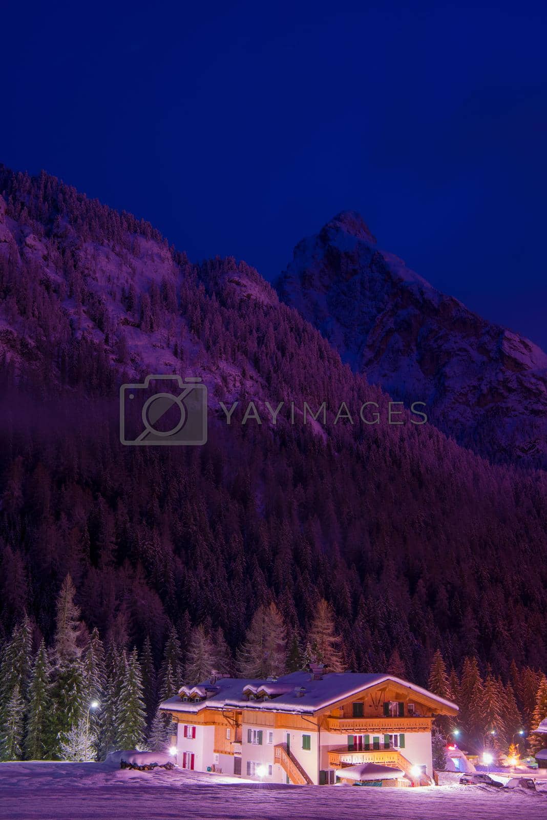 Royalty free image of mountain village in alps  at night by dotshock