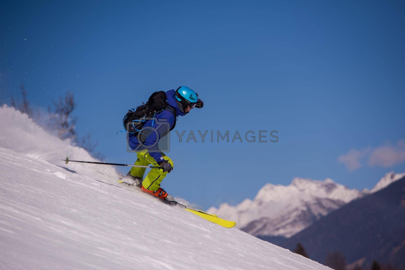 Royalty free image of Skier having fun while running downhill by dotshock