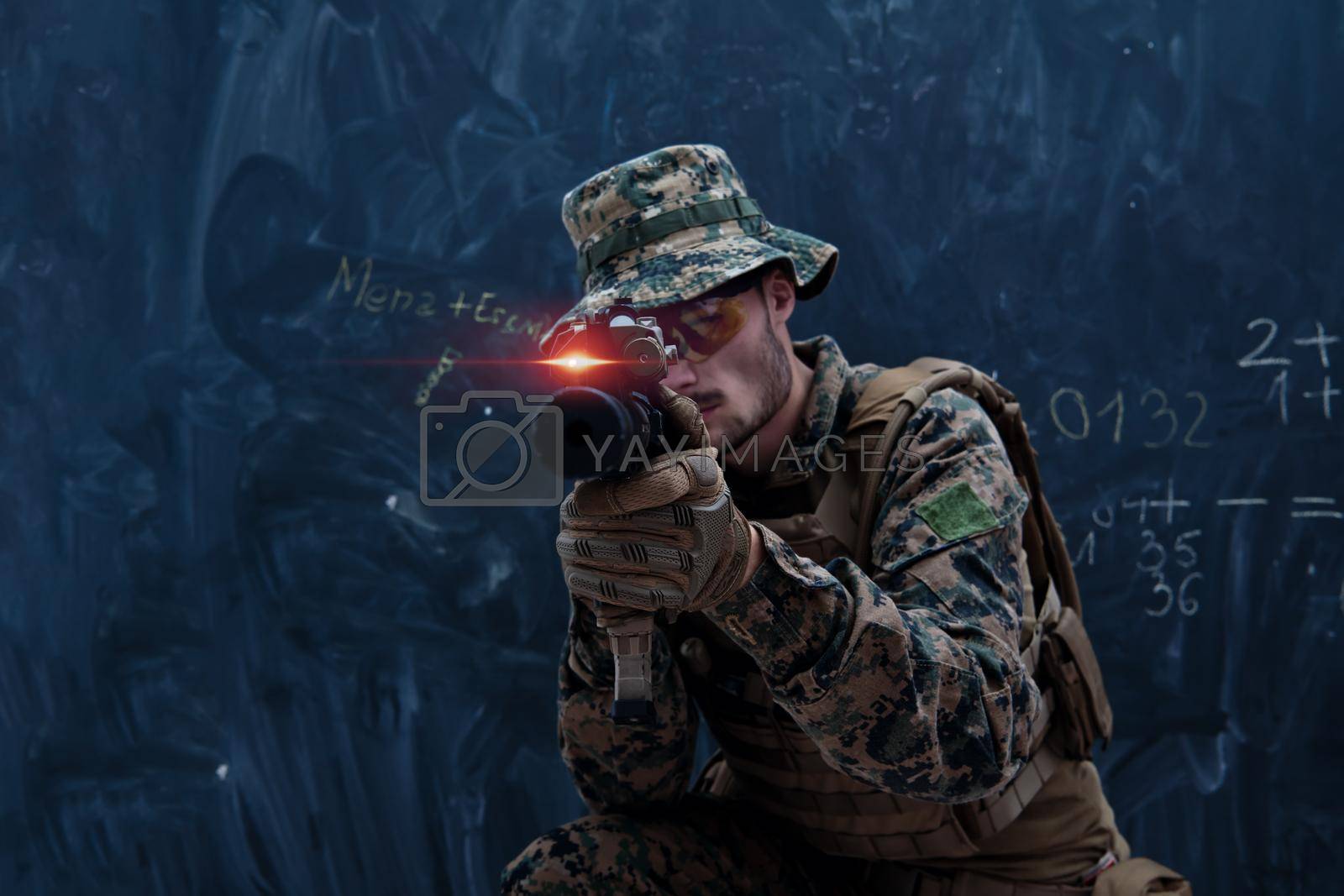 Royalty free image of soldier in action aiming laseer sight optics by dotshock