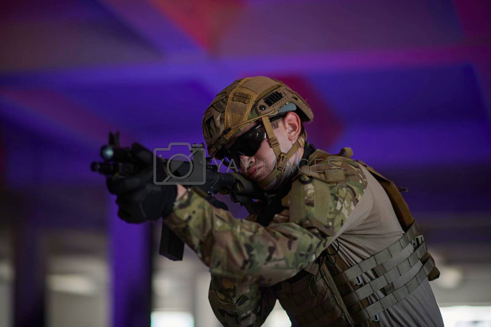 Royalty free image of modern warfare soldier in urban environment battlefield by dotshock