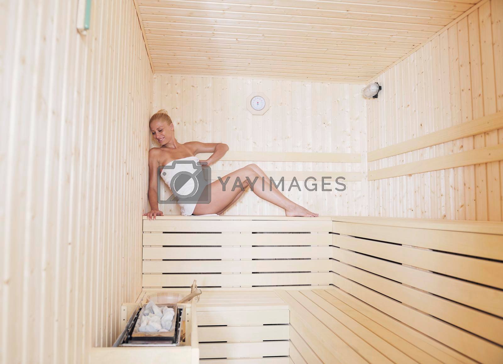 beauty spa and wellnes body treatment with young woman at  wooden sauna