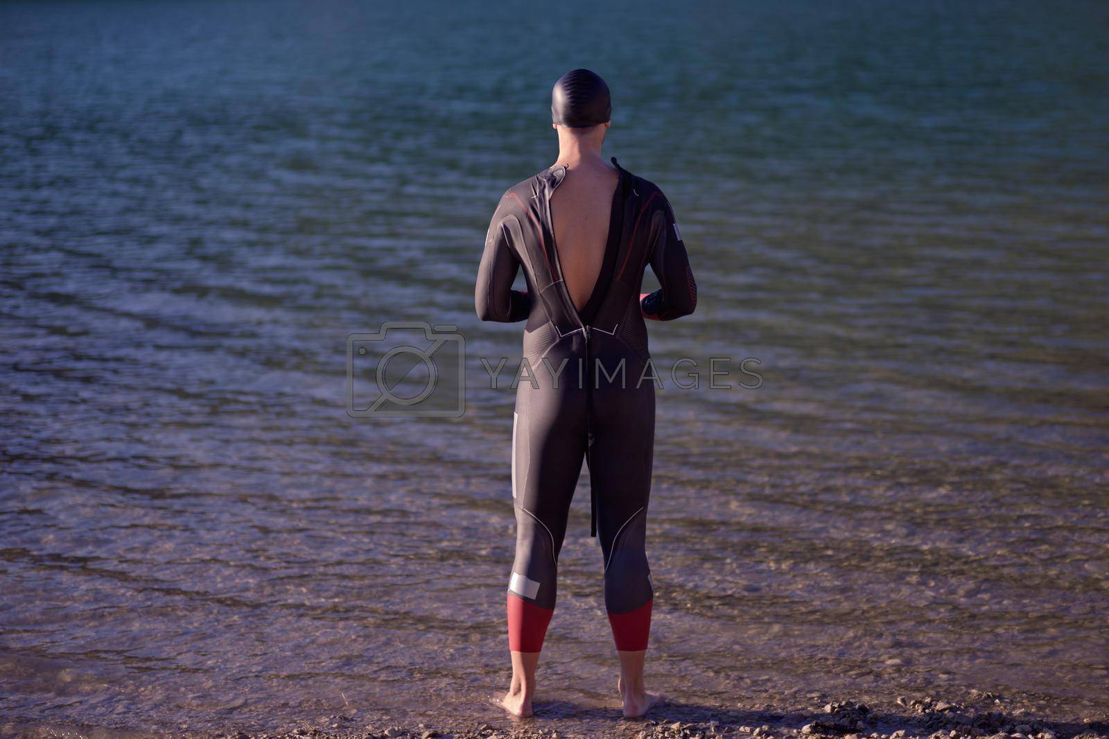 Royalty free image of triathlete swimmer portrait wearing wetsuit on training by dotshock