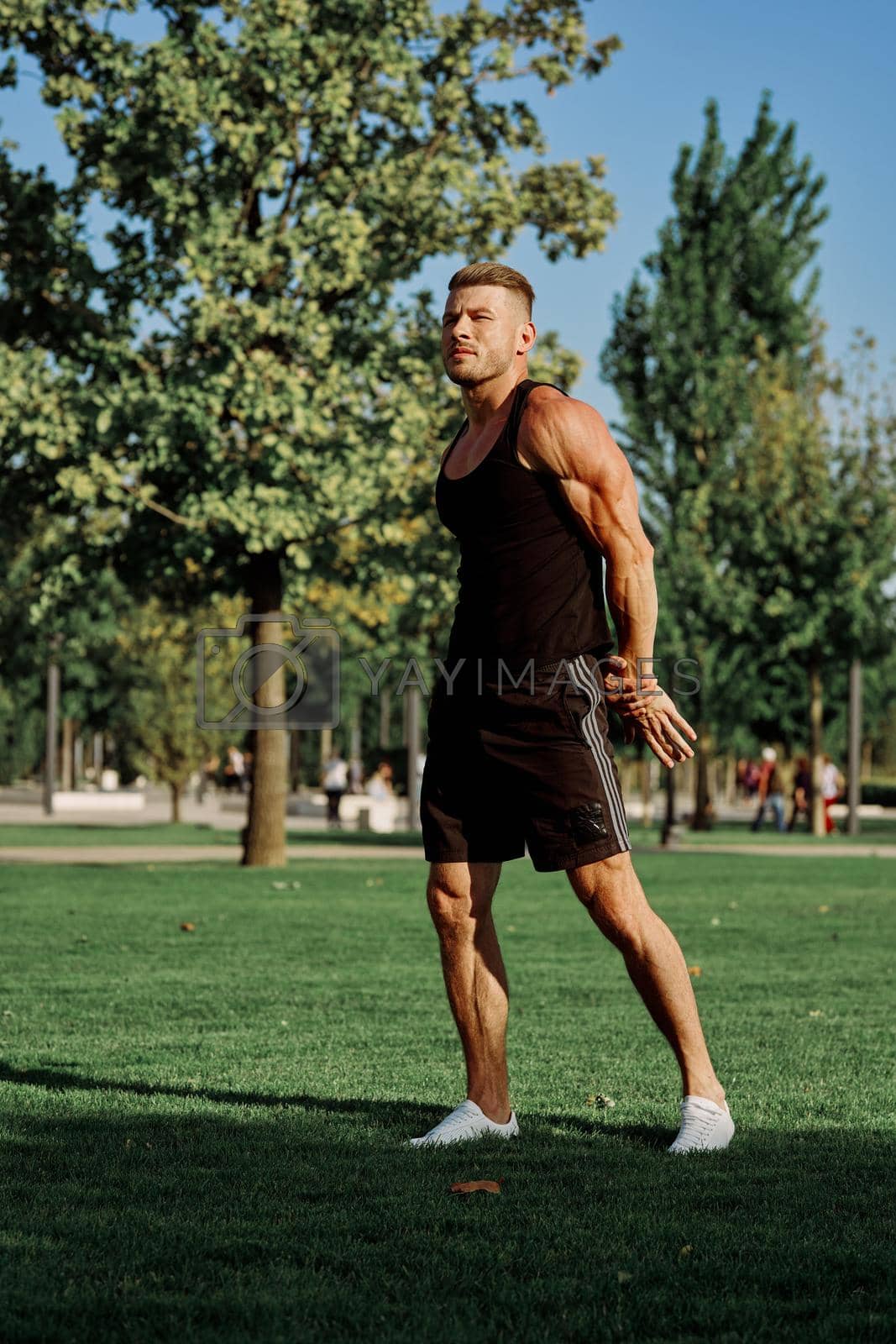 Royalty free image of sports man in the park exercise fitness cardio by Vichizh