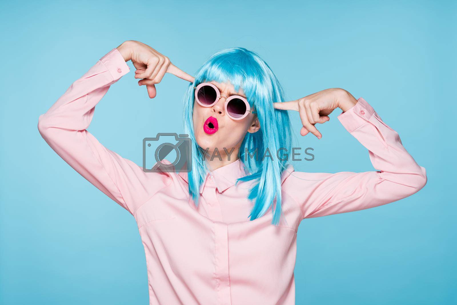 Glamorous woman blue wig makeup fashion posing. High quality photo