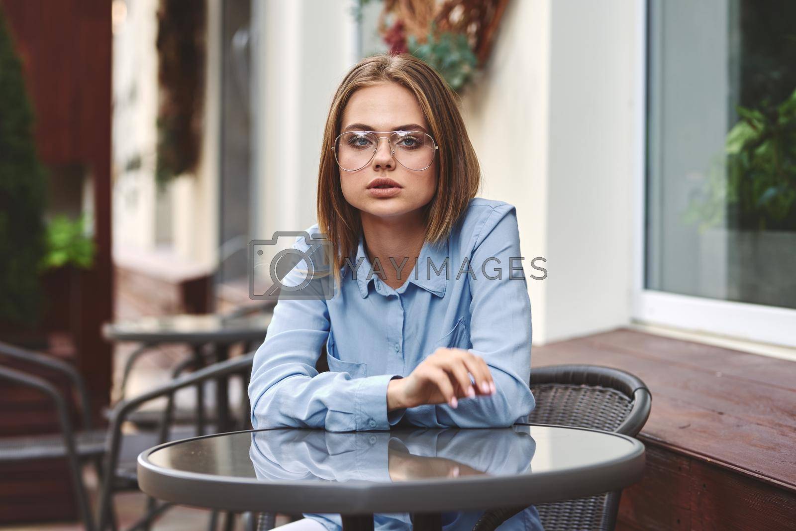 Royalty free image of business woman outdoors in a cafe leisure official professional by Vichizh