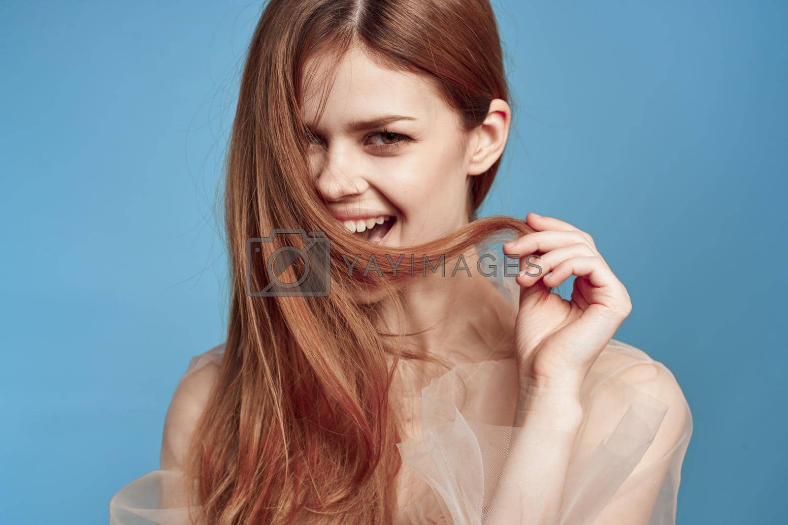 portrait of a woman attractive look lifestyle romance blue background. High quality photo