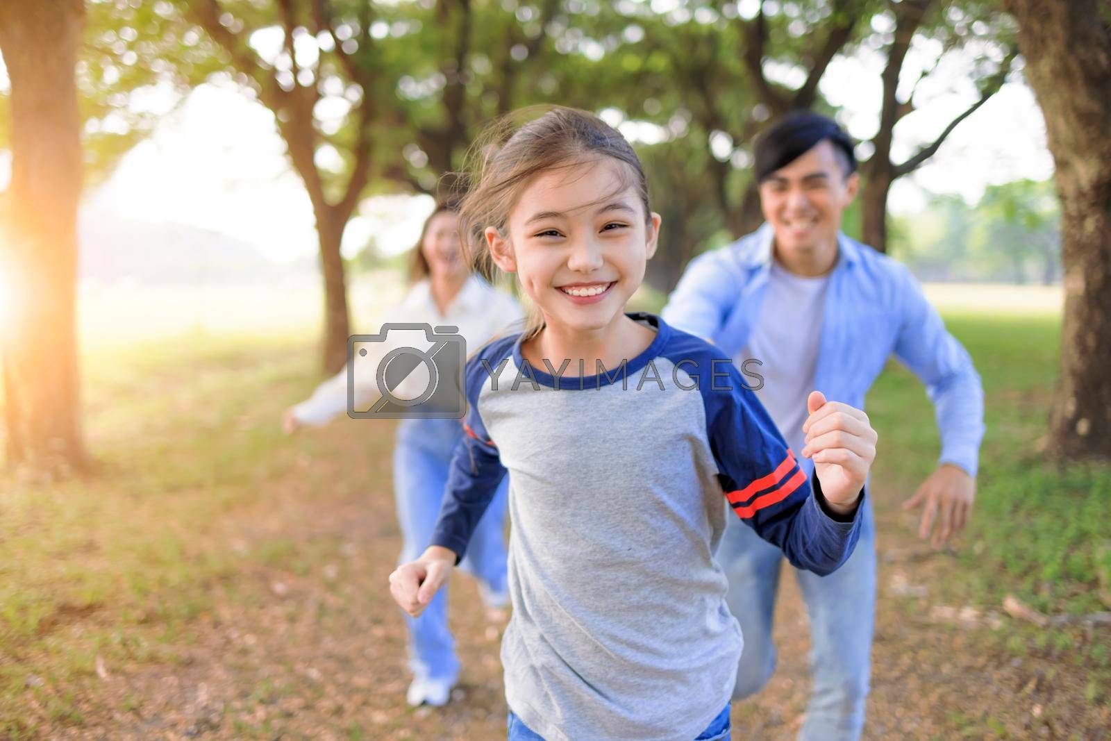 Royalty free image of Happy Family  running and playing together in the park by tomwang