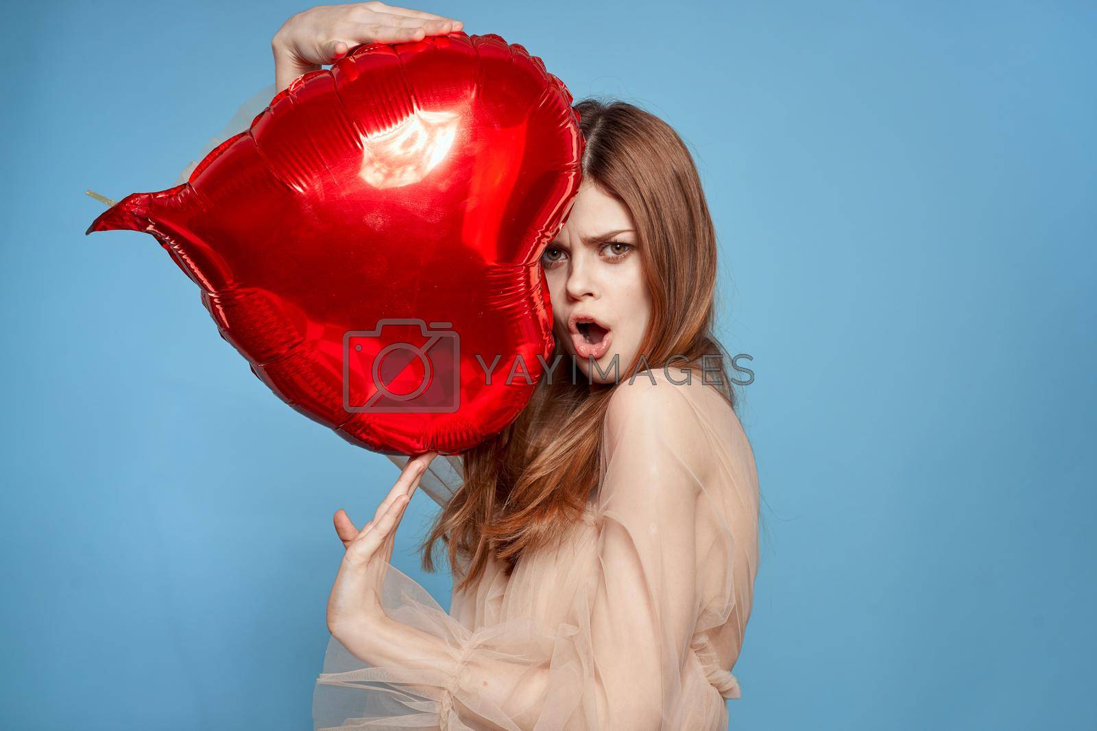 pretty woman red heart balloon fashion love romance blue background. High quality photo