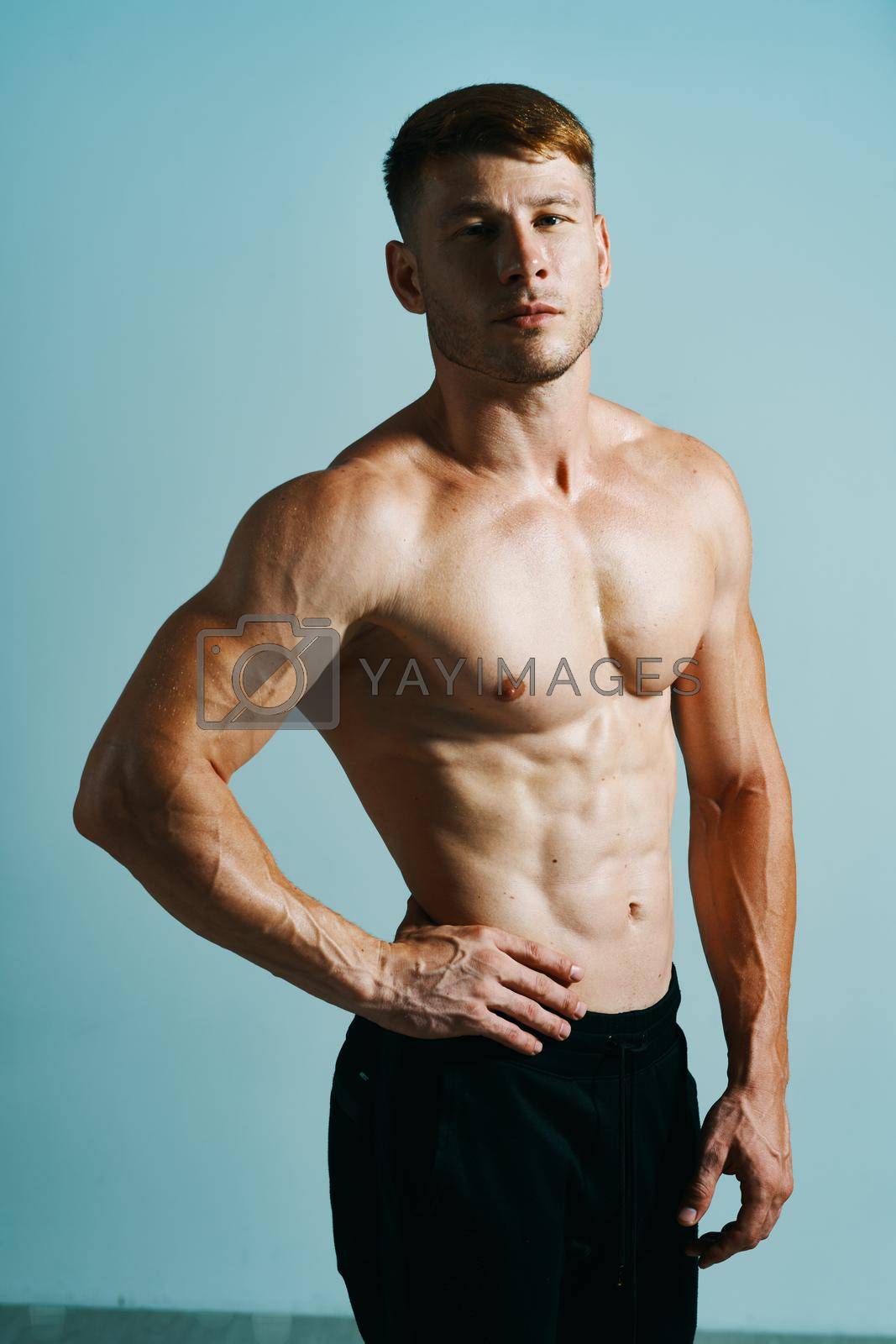 Royalty free image of male with bulging topless muscle workout posing bodybuilder by Vichizh