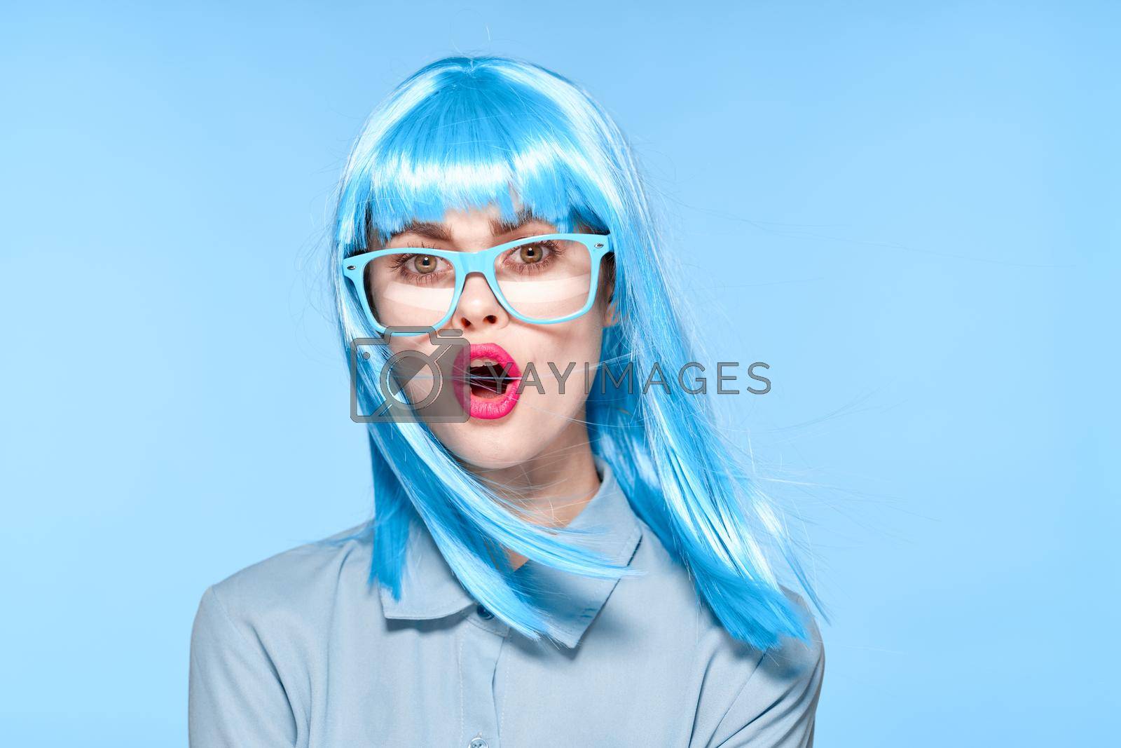 Royalty free image of pretty woman purple wig blue hair model by Vichizh
