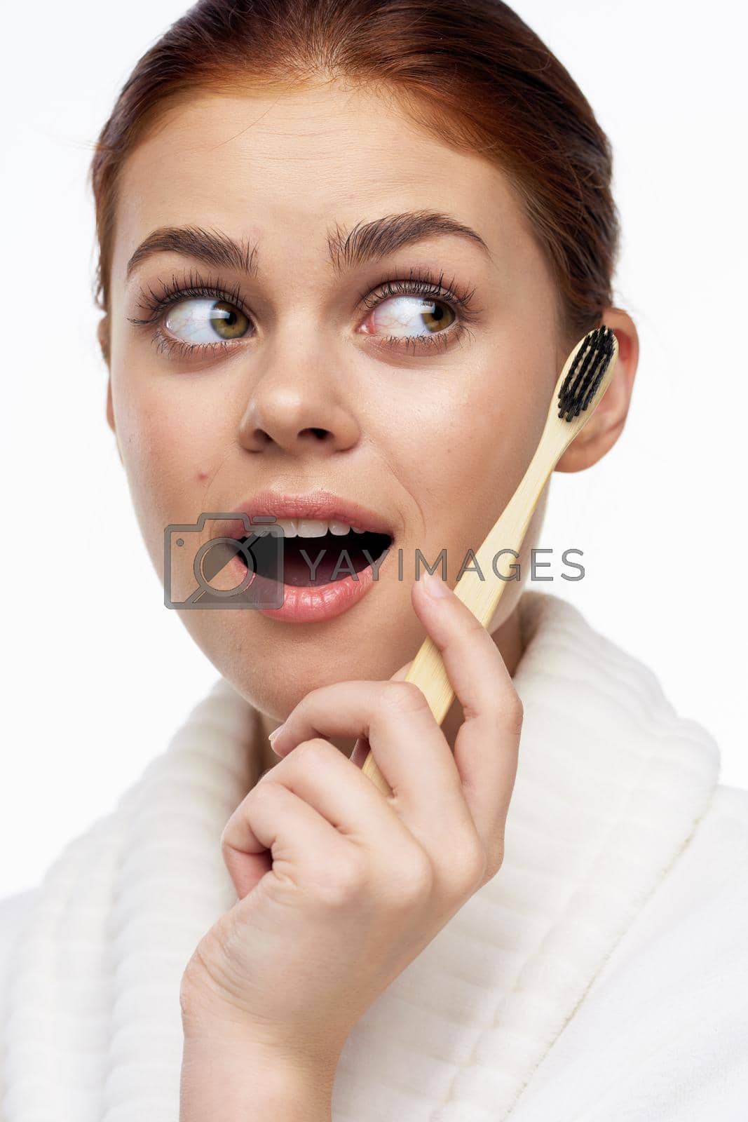Royalty free image of Woman in white coat toothbrush oral hygiene by Vichizh