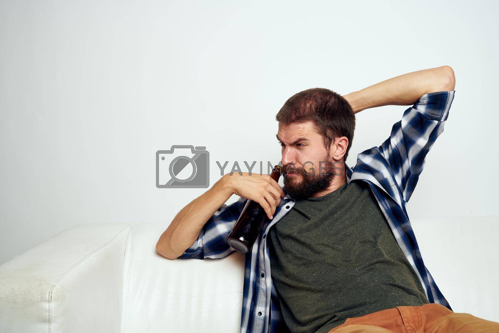 Royalty free image of drunk man alcoholism problems emotions depression light background by Vichizh