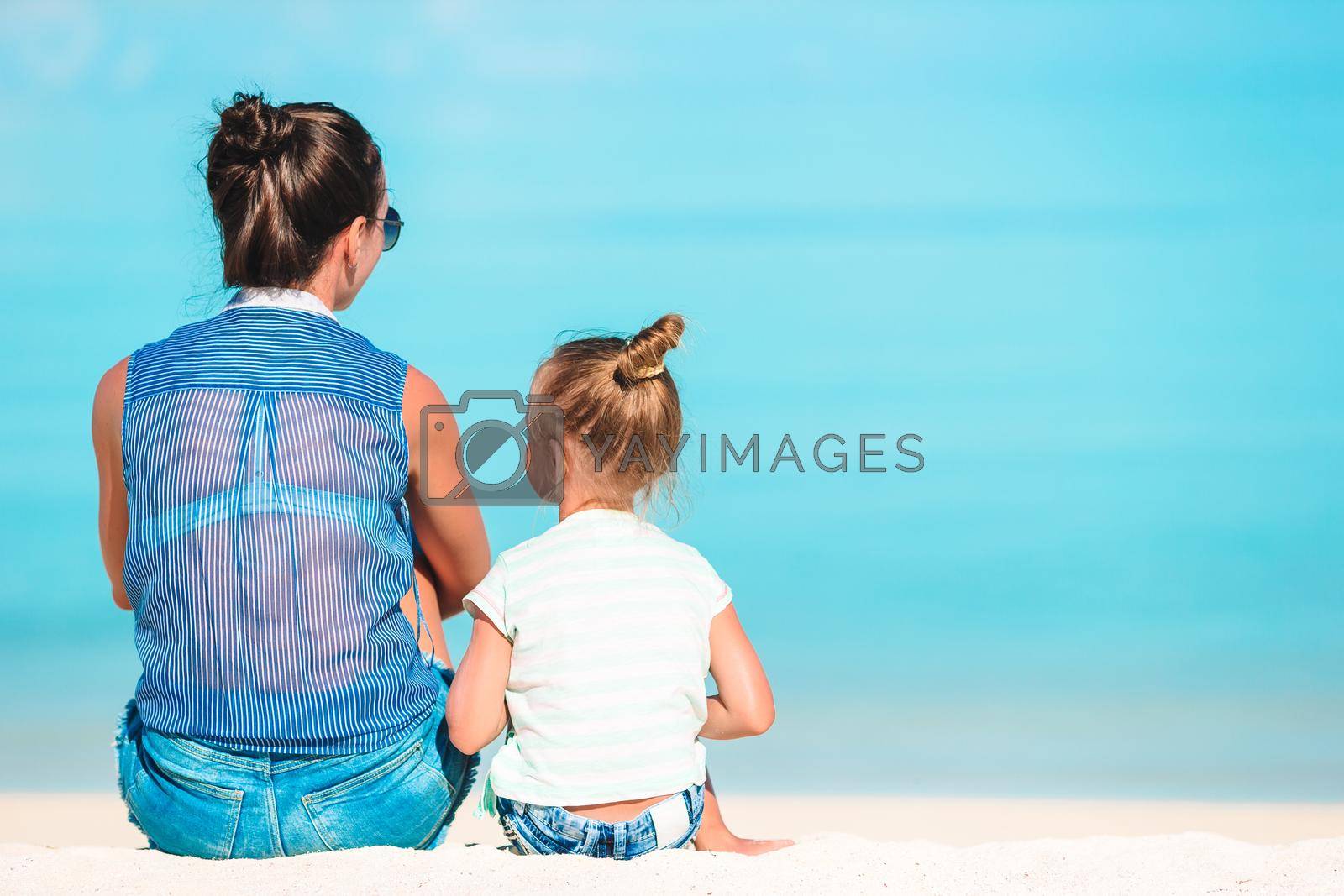 Royalty free image of Beautiful mother and daughter on Caribbean beach by travnikovstudio