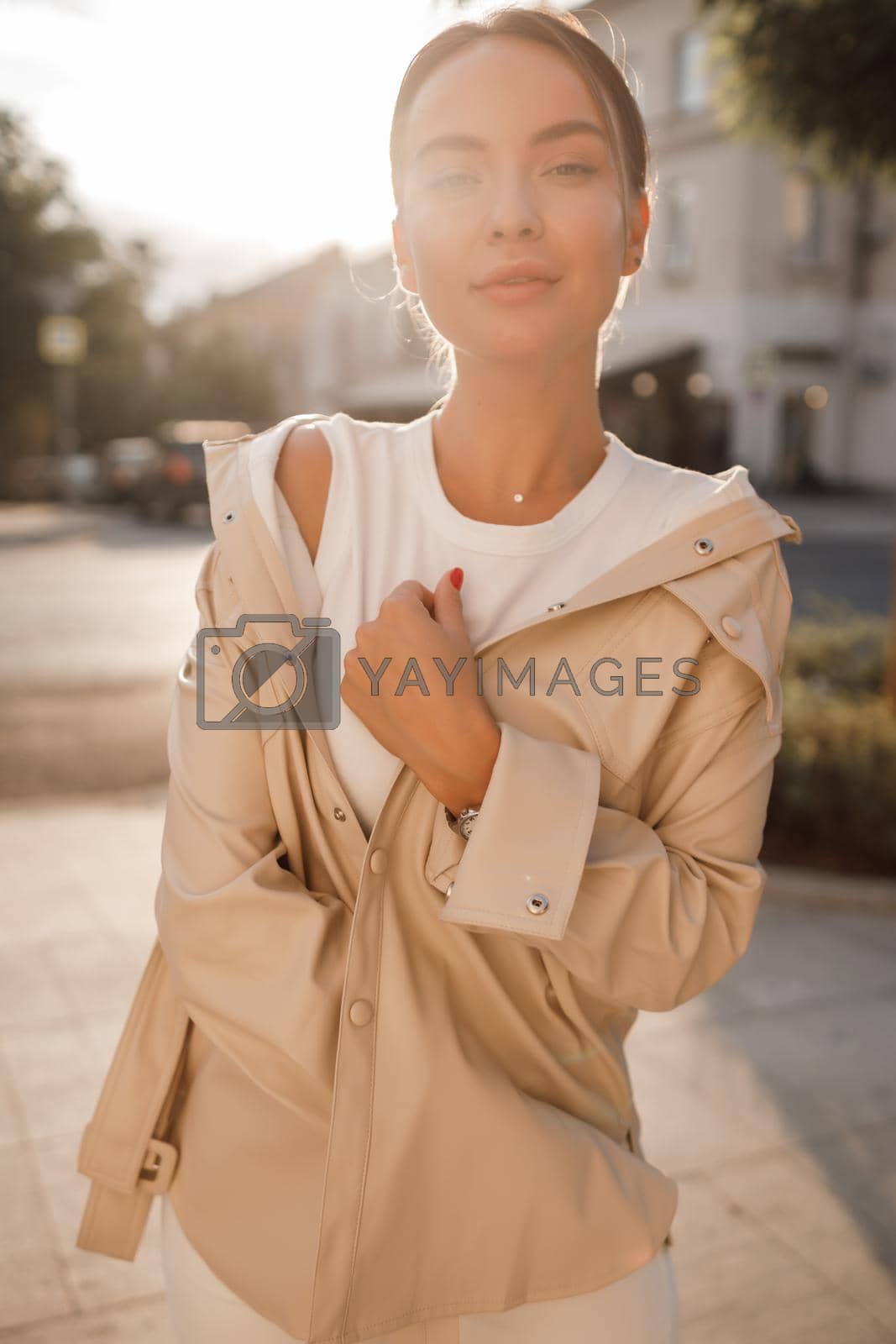 Portrait of a young fashion woman outdoors. High quality photo