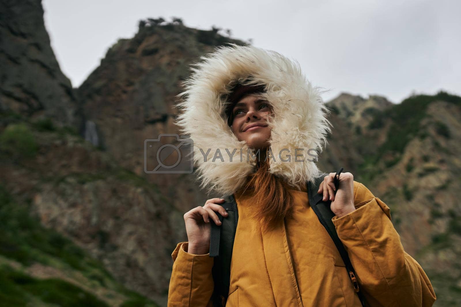 woman hiker with backpack mountains travel adventure freedom. High quality photo