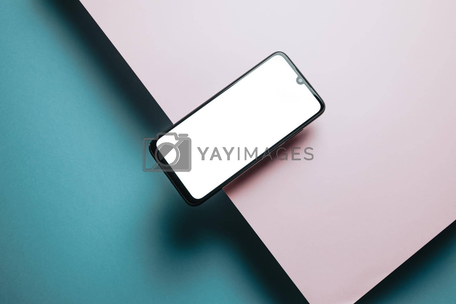 Royalty free image of Top view of mobile phone screen blank template on pink and blue background with copy space, minimal design, shapes, colorful background, young style , transgender flag, by AveCalvar