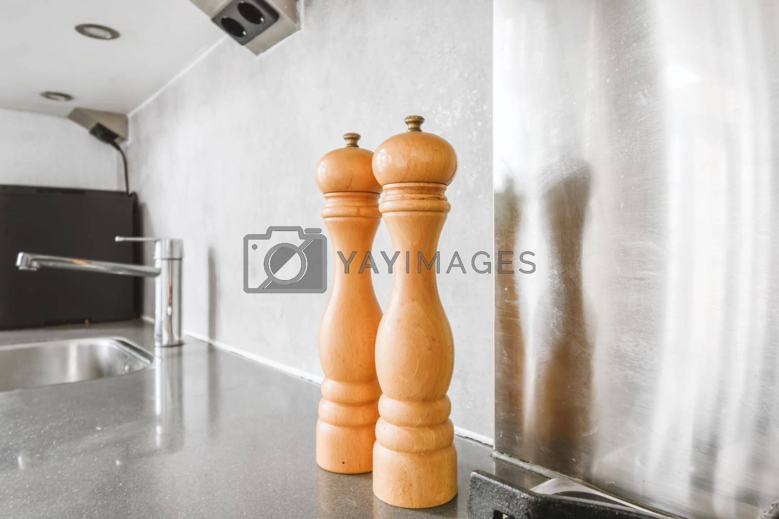 Royalty free image of Graceful salting and pepper shaker on a black countertop by casamedia