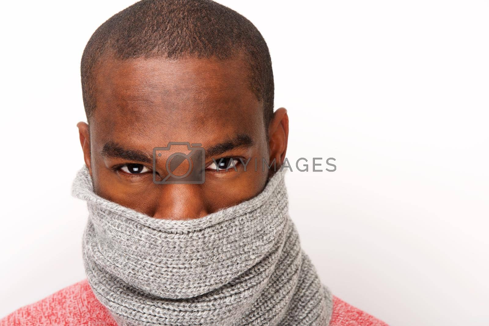 Close up portrait of cool young african american male fashion model with scarf covering face