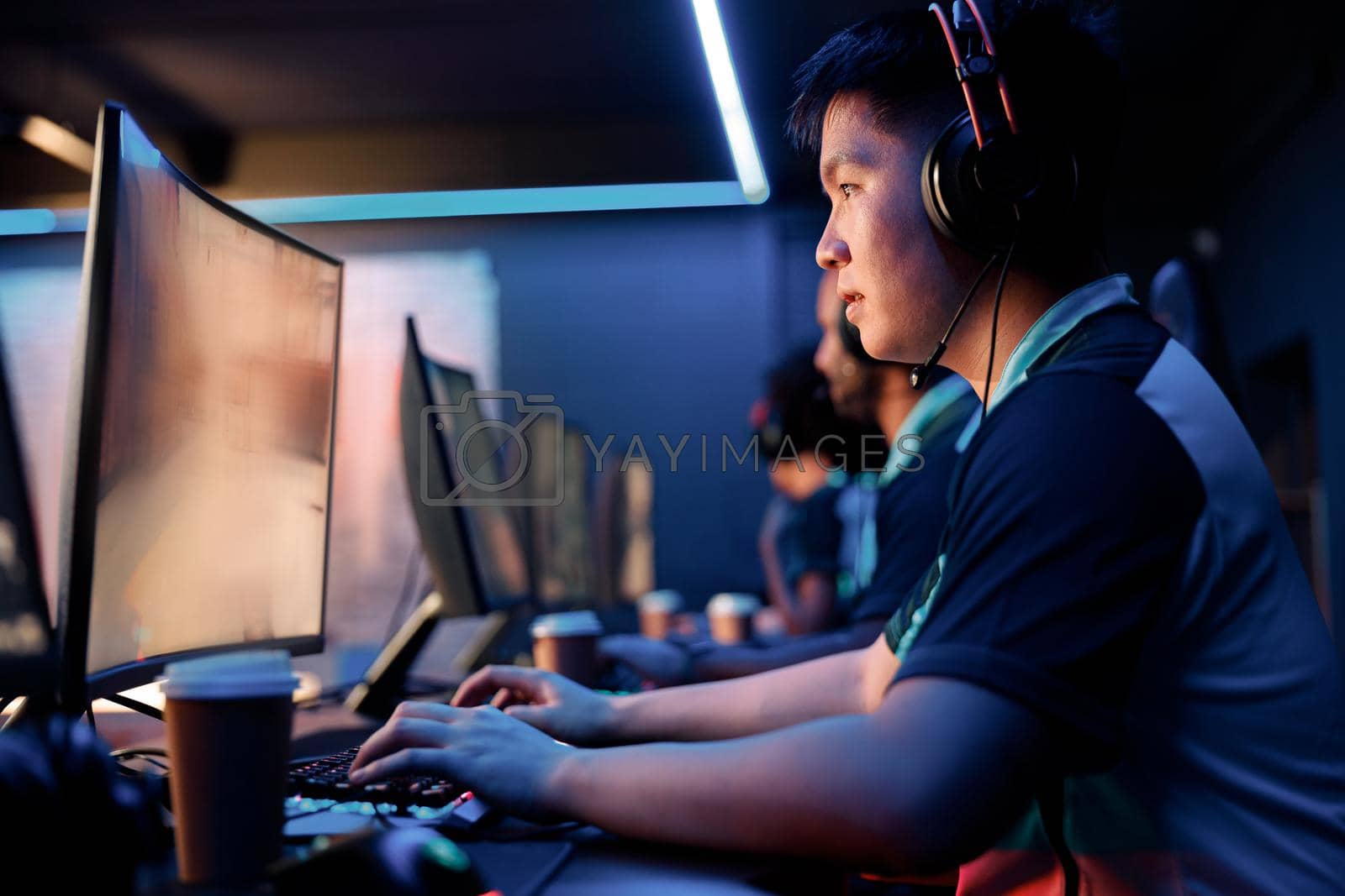 Royalty free image of Cybersport team participating in online tournament in computer club by Yaroslav_astakhov