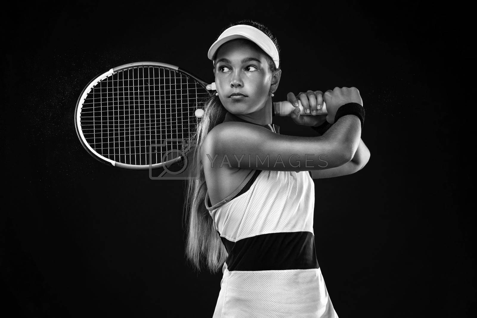 Royalty free image of Tennis player. Beautiful girl teenager and athlete with racket in pink sporswear and hat on tennis court. Fashion and sport concept. by MikeOrlov