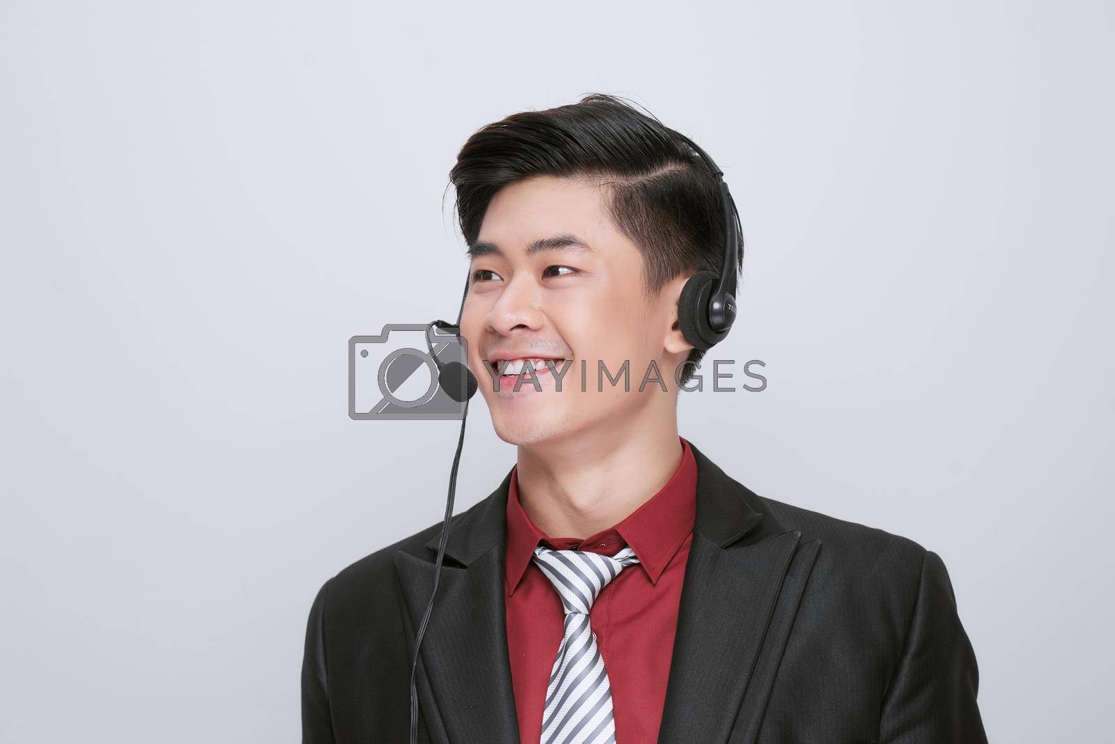 Royalty free image of Customer service representative wearing a headset on white by makidotvn