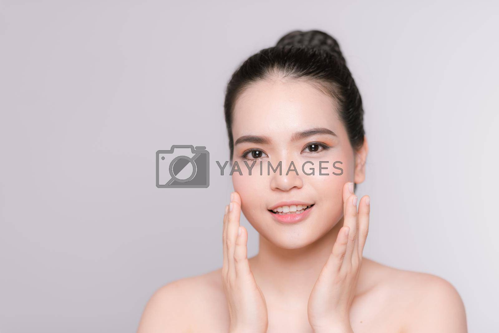 Beauty Portrait. Beautiful Spa Woman Touching her Face