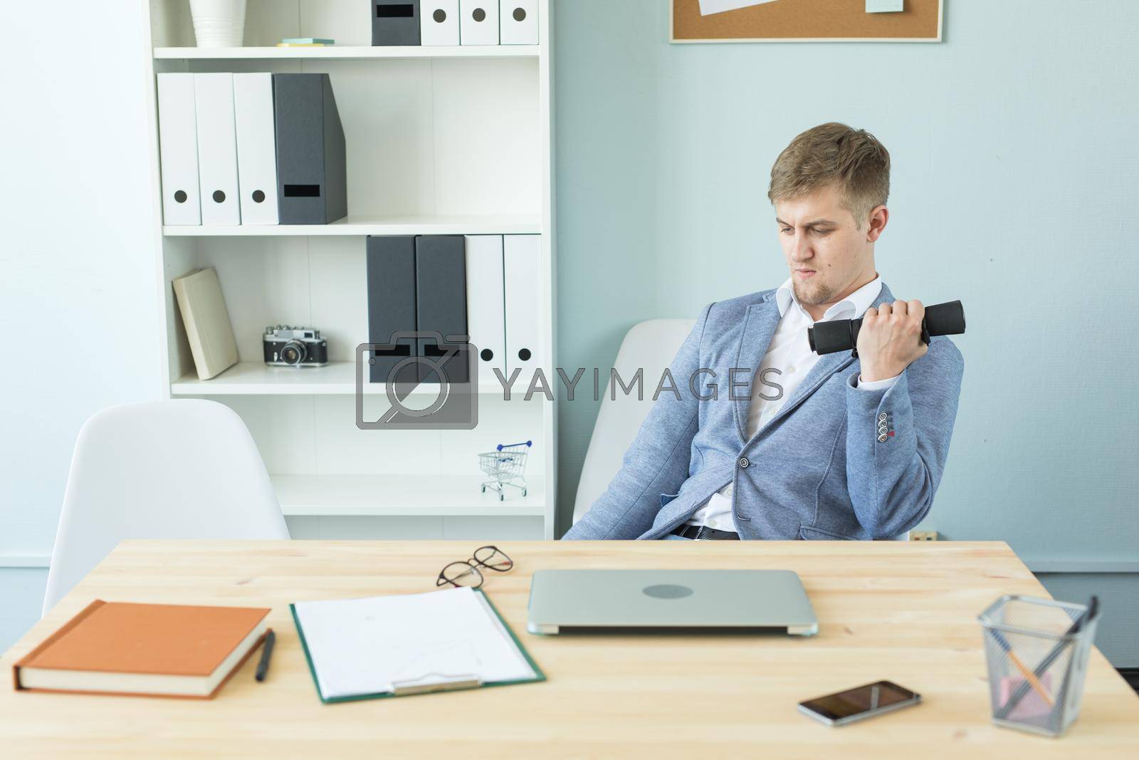 Office, fitness and people concept - Business man working and doing sport at her office.
