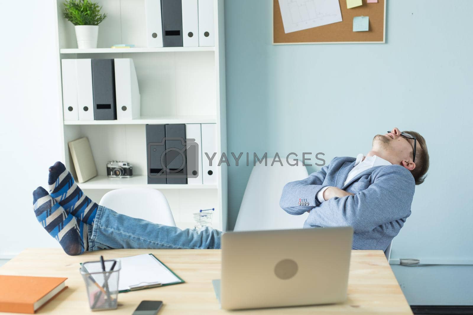 Royalty free image of Business, occupational burnout and people concept - Feeling exhausted. Businessman sleeping at his working place by Satura86