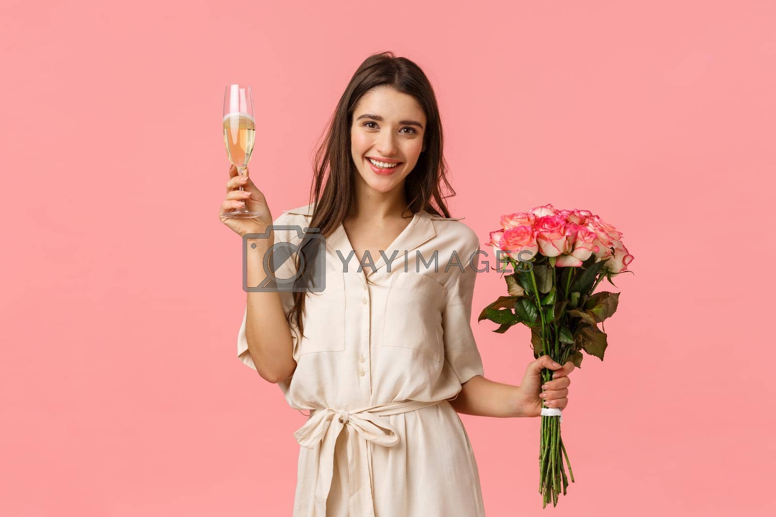 Royalty free image of Celebration, cheer and beauty concept. Beautiful young tender female in dress, holding bouquet flowers, raising glass champagne, giving toast, smiling and enjoying party, pink background by Benzoix