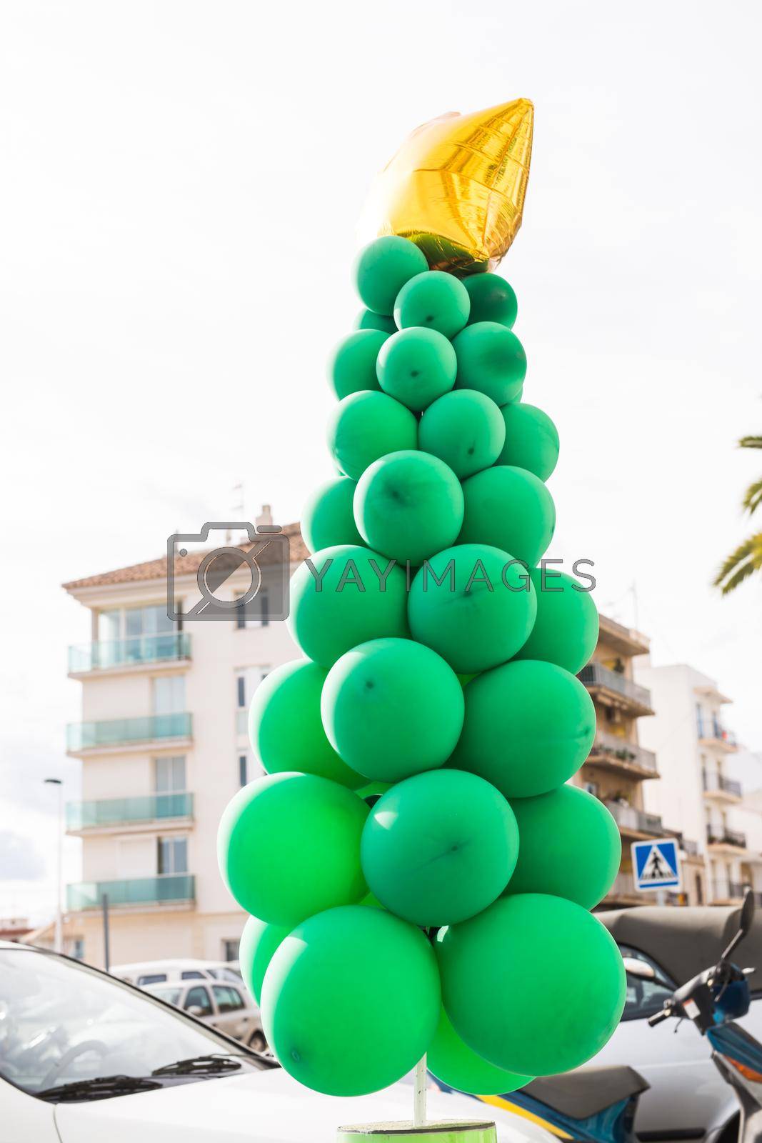 Royalty free image of Extraordinary bizarre christmas tree in the street cafe by Satura86