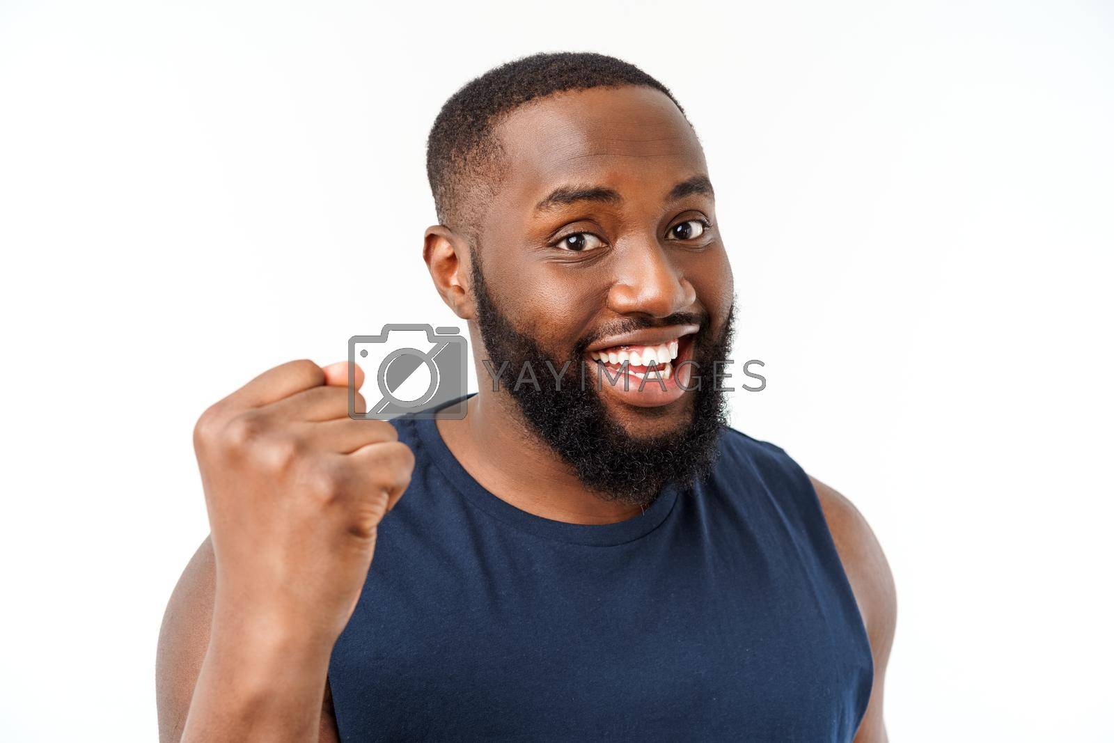 Young fitness african black man in sport wear cheering carefree and excited. Victory concept