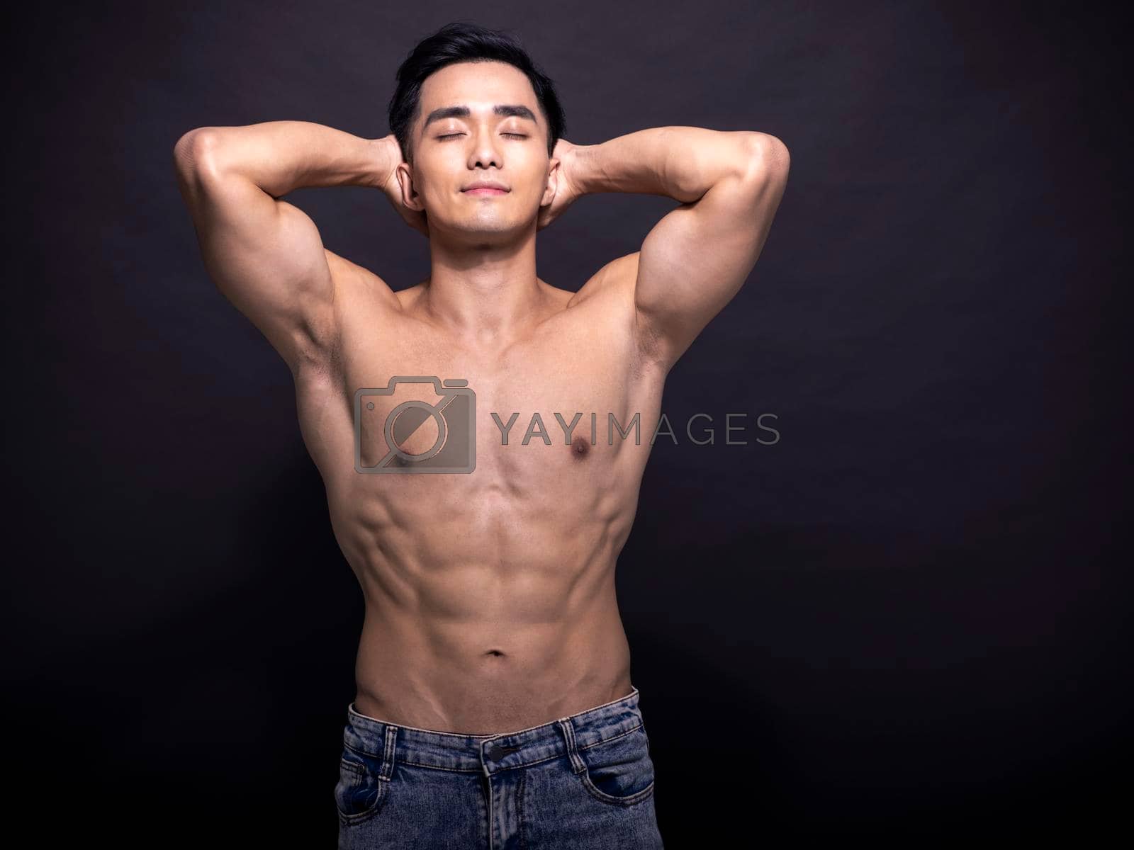 Royalty free image of Portrait of young asian bodybuilder man. by tomwang
