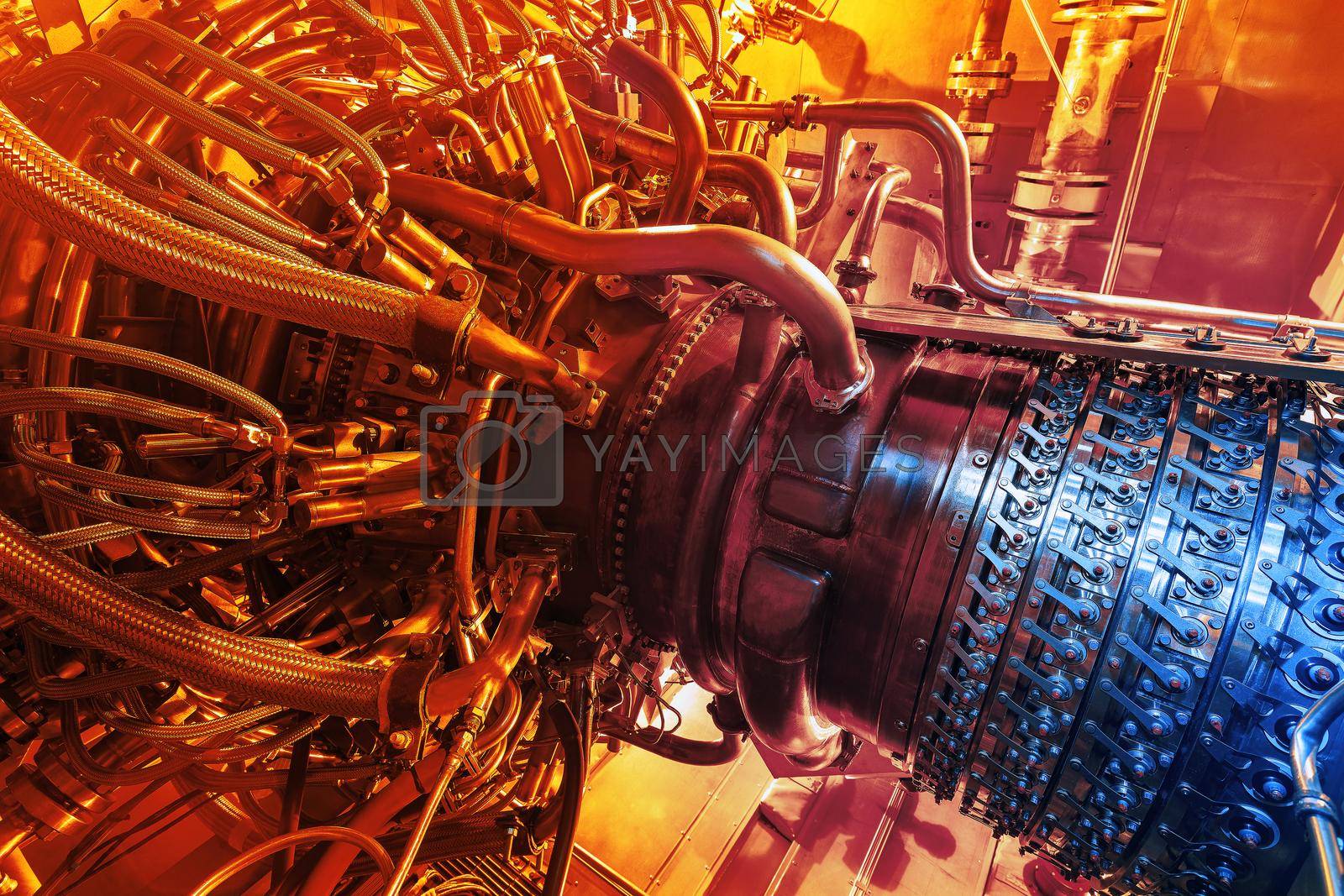 Royalty free image of Gas turbine engine located inside the aircraft. Clean energy in a power plant used on an offshore oil and gas refining central platform. Oil gas, ecology and clean energy concept by AlexGrec