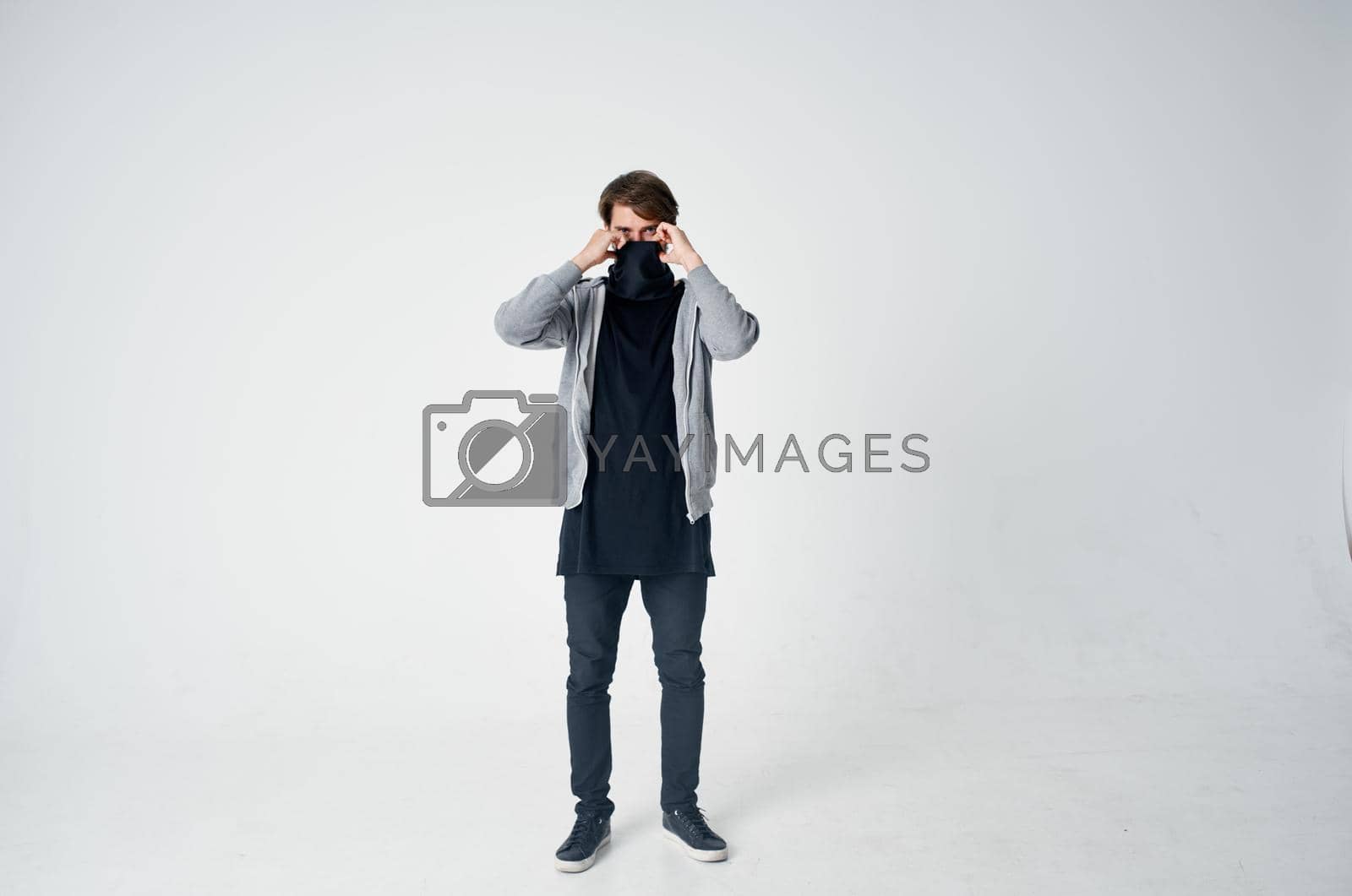 Royalty free image of male thief hooded head hacking technology security light background by SHOTPRIME