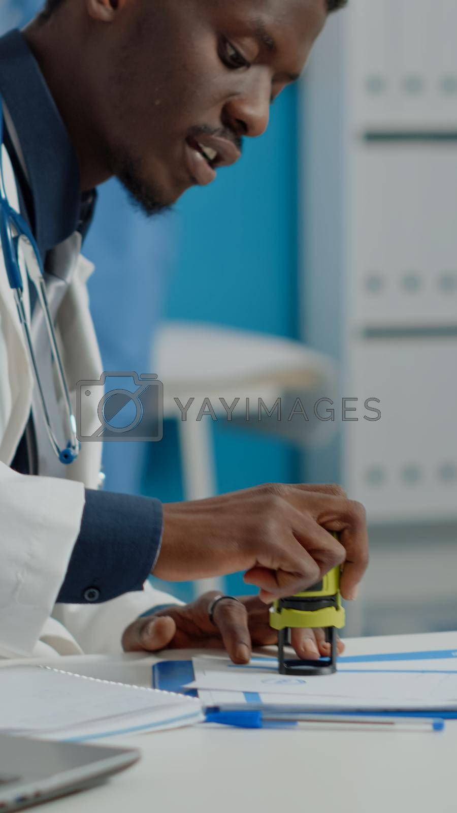 Close up of healthcare specialist using tools and files giving document to old woman for prescription medicine and advice. Doctor helping elderly patient with illness in medical office