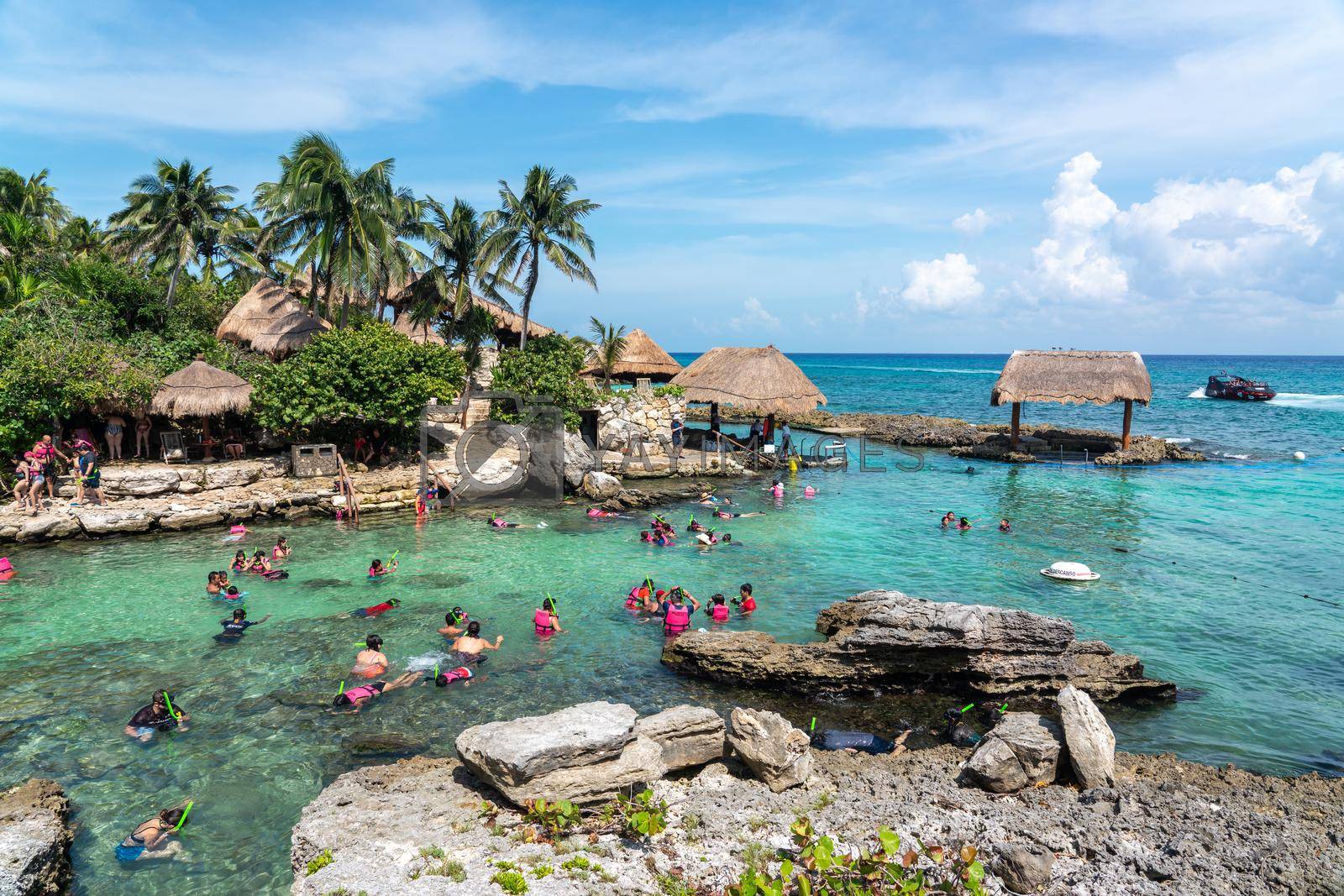 Cancun, Mexico - September 13, 2021: Snorkeling at XCaret park on the Mayan Riviera resort. XCaret is a famous ecotourism park on the mexican Mayan Riviera