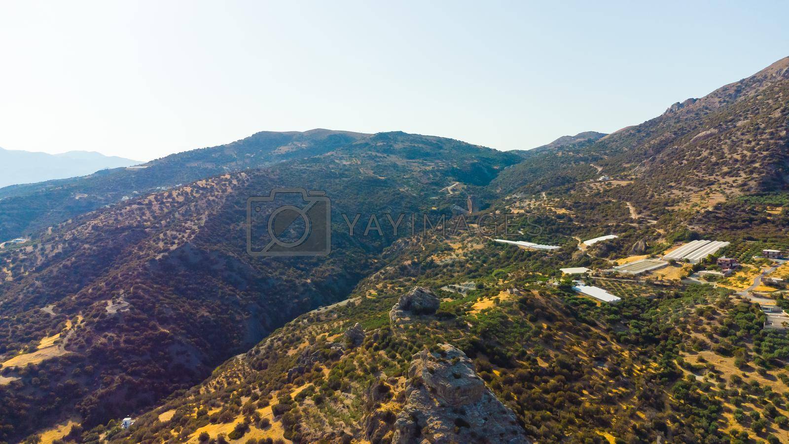 Greece, Crete, landscape with olive trees and tiny mountain village.