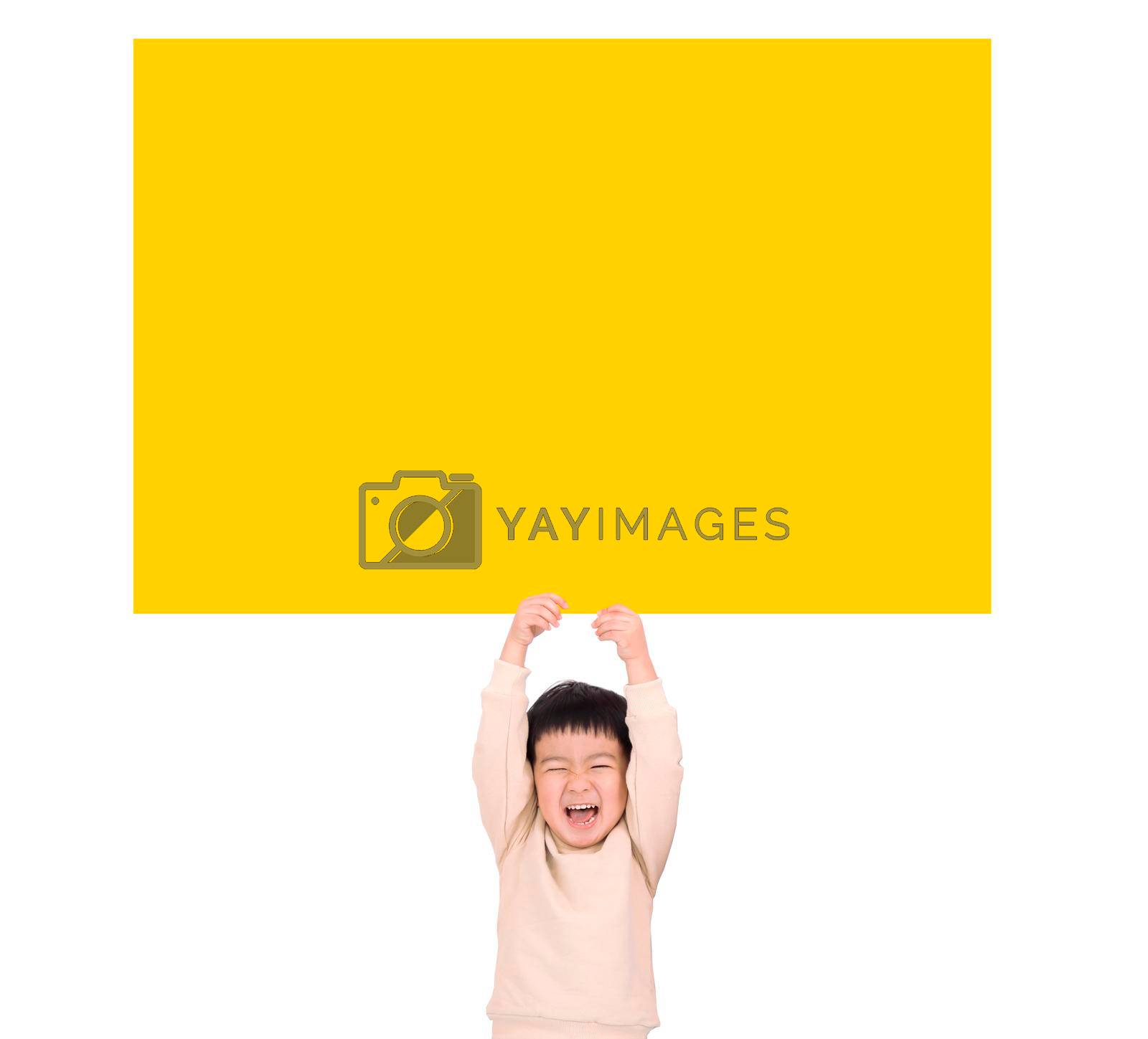 Royalty free image of Happy Little boy holding empty yellow board by tomwang