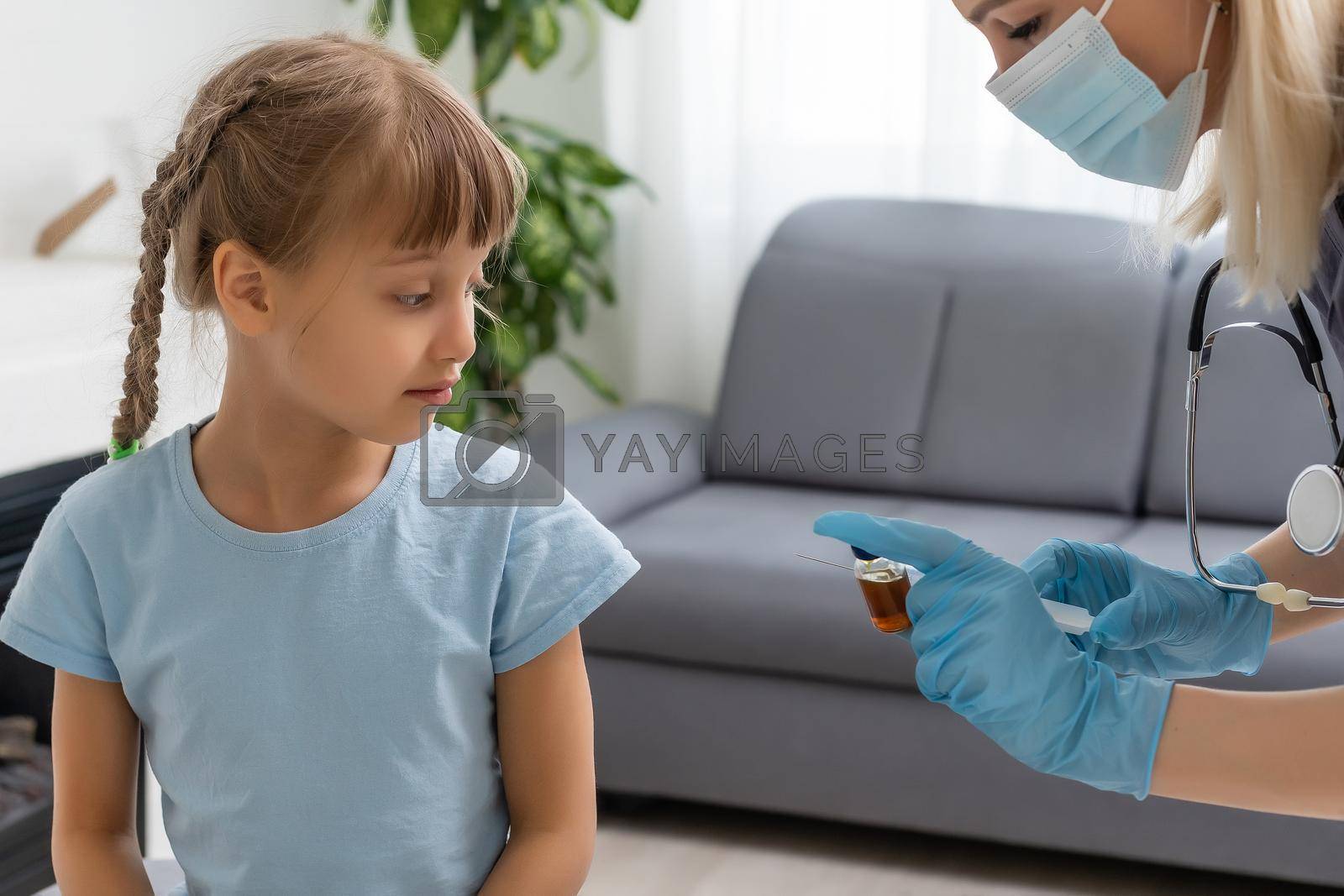 Royalty free image of The doctor makes a child vaccination by Andelov13