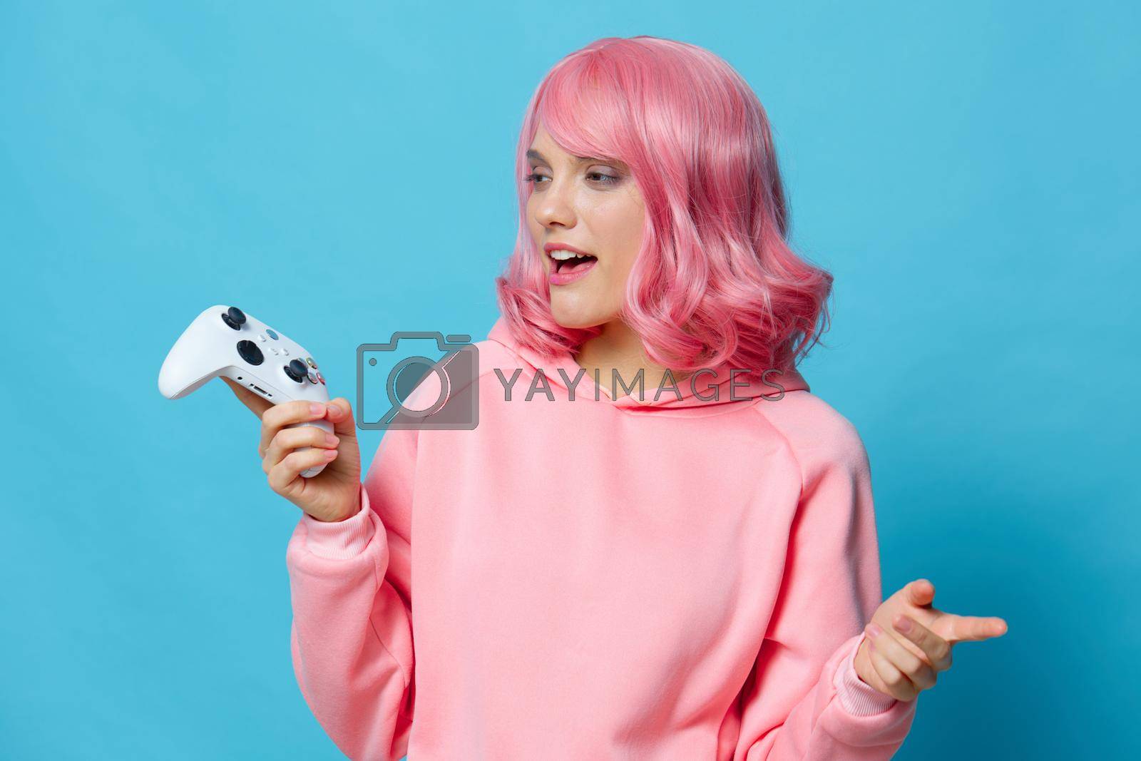 woman with a joystick in the hands of the game posing Lifestyle fashion. High quality photo